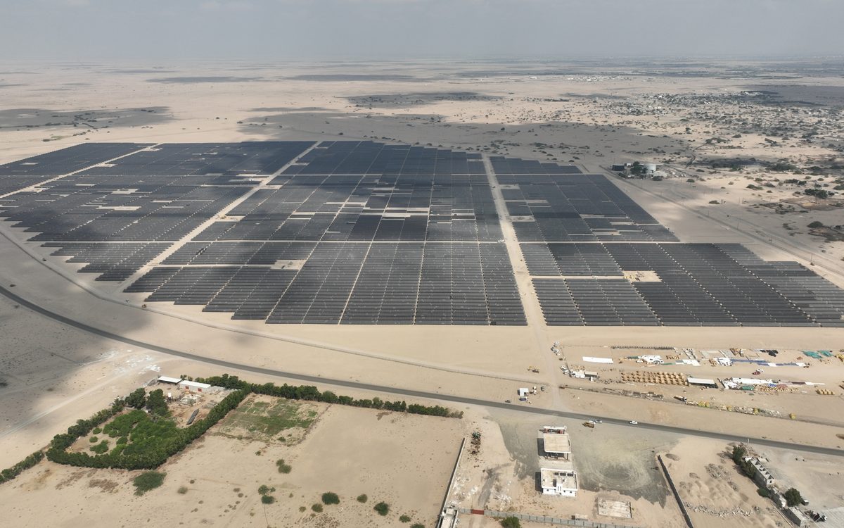 Aerial view of a utility-scale solar plant laid out in blocks